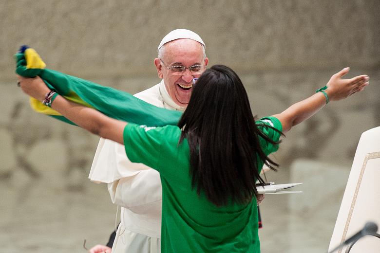 Pope Francis I greeting the crowd from the central balcony of St. Peter's Basilica moments after being elected, at the Vatican, Wednesday, March 13, 2013. Cardinal Jorge Bergoglio, who chose the name of Francis is the 266th pontiff of the Roman Catholic Church.