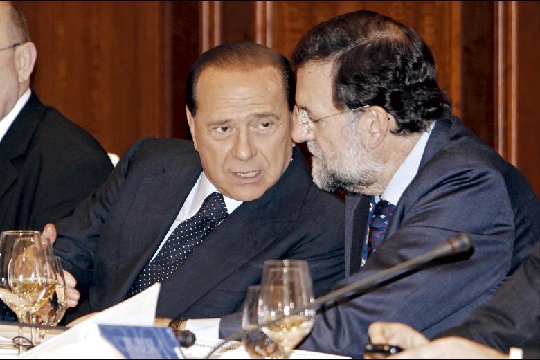 Silvio Berlusconi junto a Mariano Rajoy durante una de las reuniones del Partido Popular Europeo (EPP) en Berlín
