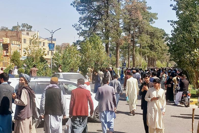 People gather on the streets in Herat on October 7, 2023. A magnitude 6.3 earthquake hit western Afghanistan October 7 morning, the United States Geological Survey said, followed by four large aftershocks with epicentres close to the region's largest city. (Photo by AFP)