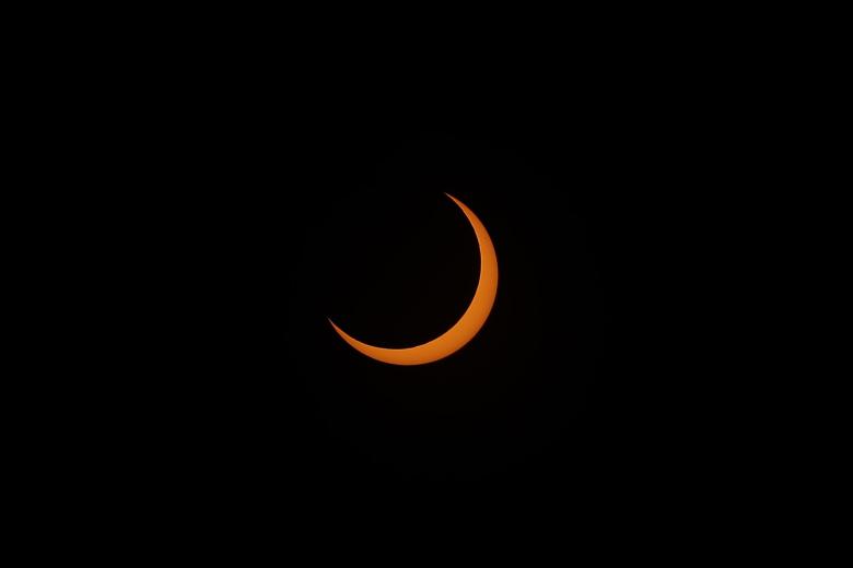Vista hoy del eclipse solar desde el observatorio de la Universidad Don Bosco, en Soyapango (El Salvador)