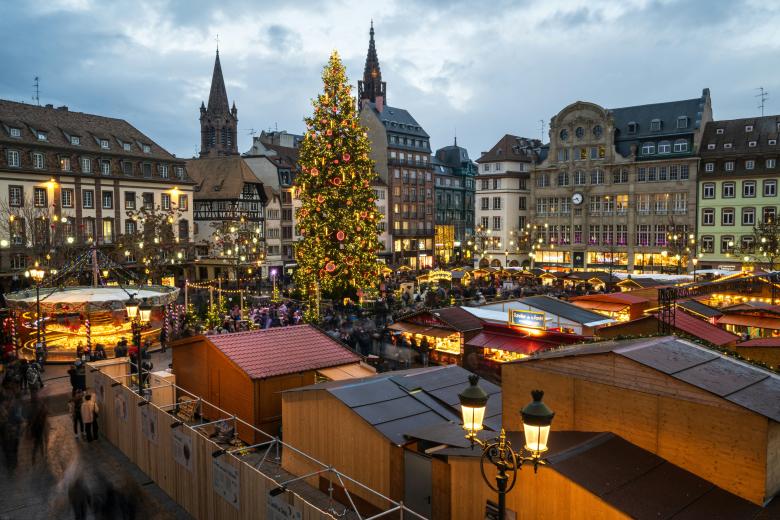 A general view shows a giant Christmas tree (C-L), as people gather on the opening day of the traditional Christmas market at Kleber square in Strasbourg, northeastern France, on November 24, 2023. (Photo by PATRICK HERTZOG / AFP)