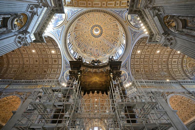 A scaffolding is mounted around the baldachin of St. Peter's basilica to start its restoration on February 21, 2024 in the Vatican. The large Baroque sculpted bronze canopy over the high altar of St. Peter's Basilica by artist Gian Lorenzo Bernini dated from 1634. (Photo by Andreas SOLARO / AFP)
