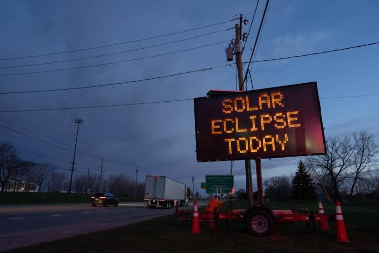 NIAGARA FALLS, NEW YORK - APRIL 8: A matrix road sign displays a message for drivers about the solar eclipse on April 8, 2024 in Lackawanna, New York. Millions of people have flocked to areas across North America that are in the "path of totality" in order to experience a total solar eclipse. During the event, the moon will pass in between the sun and the Earth, appearing to block the sun.   Adam Gray/Getty Images/AFP (Photo by Adam Gray / GETTY IMAGES NORTH AMERICA / Getty Images via AFP)