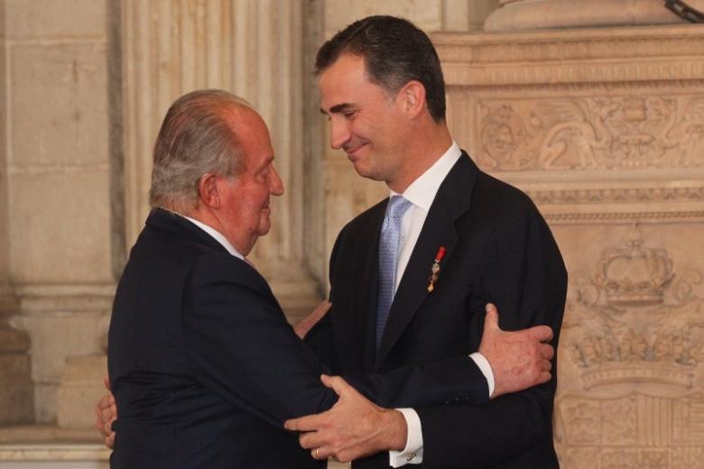 Spanish King Juan Carlos I and Crown Prince Felipe of Borbon during  the signing of the abdication law of Spain King Juan Carlos at the Royal Palace of Madrid on Wednesday 18th June 2014