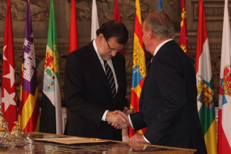 Spanish King Juan Carlos I and Crown Prince Felipe of Borbon during  the signing of the abdication law of Spain King Juan Carlos at the Royal Palace of Madrid on Wednesday 18th June 2014