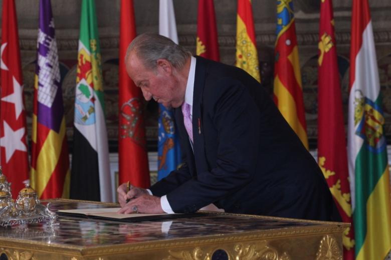 Spanish King Juan Carlos I and Crown Prince Felipe of Borbon during  the signing of the abdication law of Spain King Juan Carlos at the Royal Palace of Madrid on Wednesday 18th June 2014