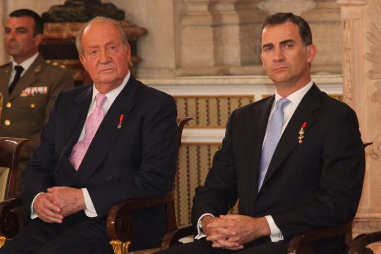 Spanish King Juan Carlos I and Crown Prince Felipe of Borbon during  the signing of the abdication law of Spain King Juan Carlos at the Royal Palace of Madrid on Wednesday 18th June 2014