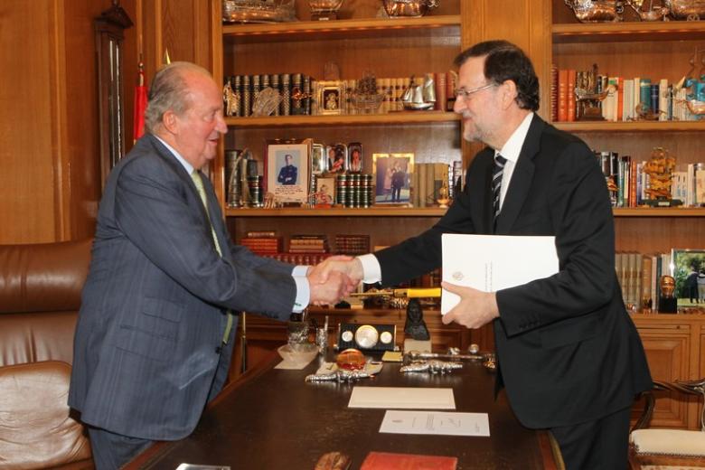 Spanish King Juan Carlos I and Crown Prince Felipe of Borbon during  the signing of the abdication law of Spain King Juan Carlos at the Royal Palace of Madrid on Wednesday 18th June 2014