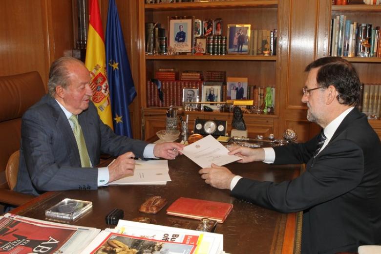 Spanish King Juan Carlos I and Crown Prince Felipe of Borbon during  the signing of the abdication law of Spain King Juan Carlos at the Royal Palace of Madrid on Wednesday 18th June 2014