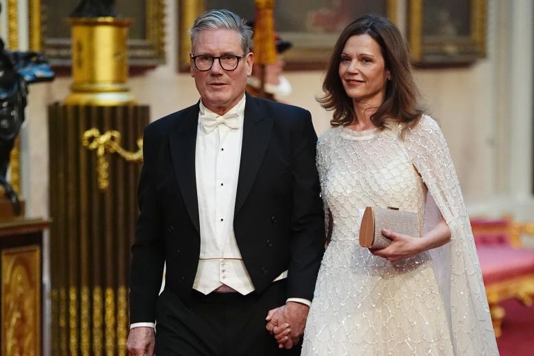 Labour leader Sir Keir Starmer with his wife Victoria make their way along the East Gallery to attend the State Banquet for Emperor Naruhito and his wife Empress Masako of Japan at Buckingham Palace, London, as part of their state visit to the UK. Picture date: Tuesday June 25, 2024.