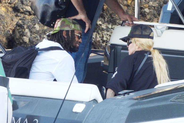 BGUK_2998405 - Portofino, ITALY  - The Legendary American Singer/Songwriter Madonna spotted out in the Italian sunshine arriving at Dolce and Gabbana's Portofino Villa with her new mystery man.

The 65-year old showed off her cool side, wearing her New York Yankee top, sunglasses and cap as she arrived in style via a boat as the 'Queen of Pop' was helped ashore by her entourage as she spends her holidays at the designers pad with her mystery beau.

Pictured: Madonna

BACKGRID UK 11 AUGUST 2024 

BYLINE MUST READ: COBRA TEAM / BACKGRID

UK: +44 208 344 2007 / uksales@backgrid.com

USA: +1 310 798 9111 / usasales@backgrid.com

*Pictures Containing Children Please Pixelate Face Prior To Publication* *** Local Caption *** .