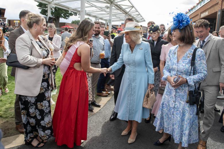 Queen Camilla (centre) during a visit to open the Bustardthorpe Development at York Racecourse, which has been designed to improve the experience for racegoers and has sustainability at its heart, with rainwater harvest tanks, solar panels and a living roof during day four of the Sky Bet Ebor Festival at York Racecourse. Picture date: Saturday August 24, 2024. *** Local Caption *** .