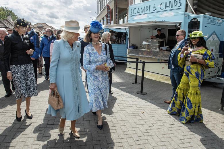 Queen Camilla meets the Falcons Display Team during a visit to open the Bustardthorpe Development at York Racecourse, which has been designed to improve the experience for racegoers and has sustainability at its heart, with rainwater harvest tanks, solar panels and a living roof during day four of the Sky Bet Ebor Festival at York Racecourse. Picture date: Saturday August 24, 2024. *** Local Caption *** .