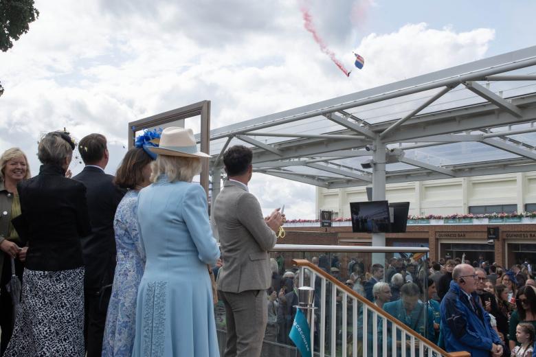 Queen Camilla meets the Falcons Display Team during a visit to open the Bustardthorpe Development at York Racecourse, which has been designed to improve the experience for racegoers and has sustainability at its heart, with rainwater harvest tanks, solar panels and a living roof during day four of the Sky Bet Ebor Festival at York Racecourse. Picture date: Saturday August 24, 2024. *** Local Caption *** .