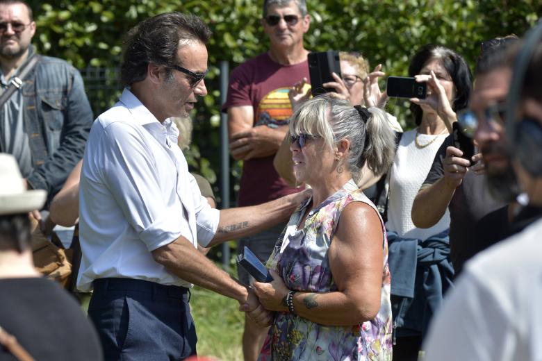 French actor Anthony Delon pays his respect in front of bunches of flowers and messages displayed at the entrance gate of his father's property pior to a private funeral of late French actor Alain Delon La Brulerie in Douchy, central France, on August 24, 2024. French film legend Alain Delon has died at the age of 88, his three children told AFP in a statement on August 18, 2024, following a battle with ill health. Photo by Florian Poitout/ABACAPRESS.COM