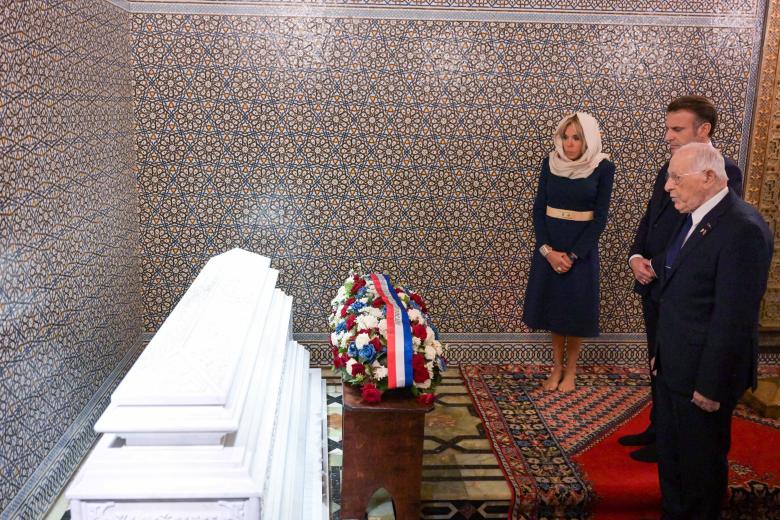 French President Emmanuel Macron and his wife Brigitte Macron, flanked by Colonel Hassan Skalli, pay their respects at the tomb of King Hassan II during a moment of silence at Mausoleum of Mohammed V in Rabat, Morocco on October 29 2024. Photo by Ammar Abd Rabbo/ABACAPRESS.COM