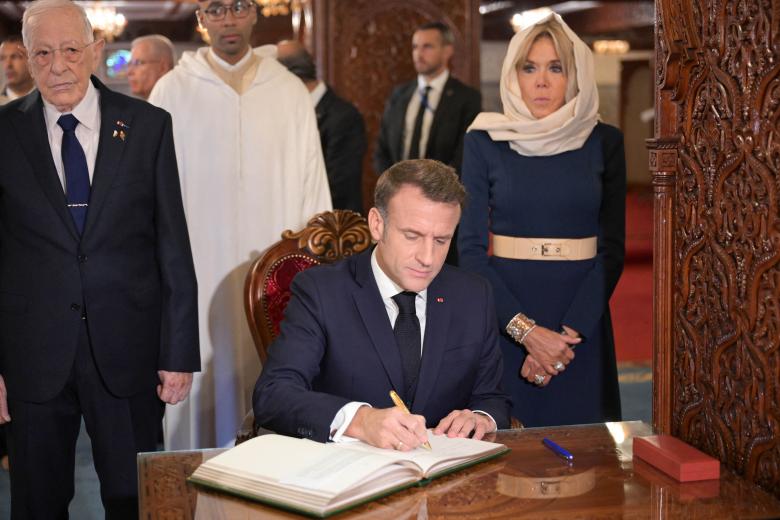 French President Emmanuel Macron and his wife Brigitte Macron, flanked by Colonel Hassan Skalli, visit to Mausoleum of Mohammed V in Rabat, Morocco on October 29 2024. Photo by Ammar Abd Rabbo/ABACAPRESS.COM