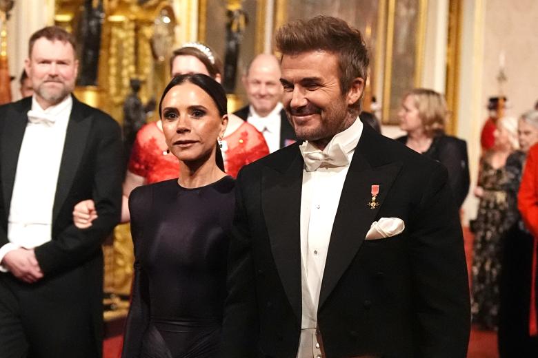 David and Victoria Beckham make their way along the East Gallery to attend the state banquet for the Emir of Qatar Sheikh Tamim bin Hamad Al Thani at Buckingham Palace, London, during his state visit to the UK. Picture date: Tuesday December 3, 2024.