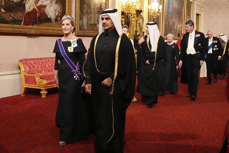 The Duchess of Edinburgh and H.E. Mr. Saad bin Sherida Al Kaabi make their way along the East Gallery to attend the state banquet for the Emir of Qatar Sheikh Tamim bin Hamad Al Thani at Buckingham Palace, London, during his state visit to the UK. Picture date: Tuesday December 3, 2024. *** Local Caption *** .