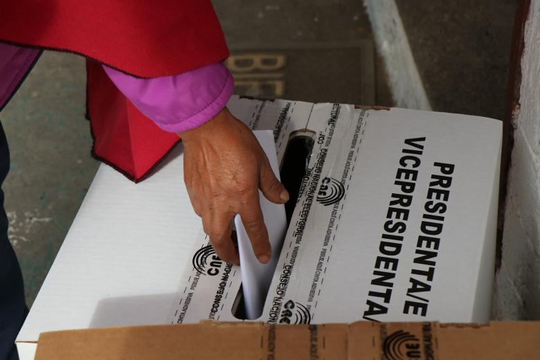 A man votes at a polling station during the presidential election in Guayaquil, Guayas province, Ecuador, on February 9, 2025. Some 14 million Ecuadorans began voting Sunday to decide who will lead the violence-wracked Andean nation through its worst crisis in half a century. (Photo by MARCOS PIN / AFP)