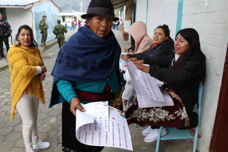 A woman casts her vote at a polling station during the presidential election in Toacazo, Cotopaxi province, Ecuador, on February 9, 2025. Some 14 million Ecuadorans began voting Sunday to decide who will lead the violence-wracked Andean nation through its worst crisis in half a century. (Photo by Galo Paguay / AFP)