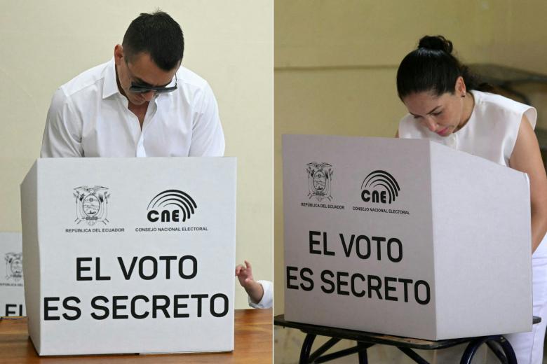 A woman receives her ballot before voting at a polling station during the presidential election in Toacazo, Cotopaxi province, Ecuador, on February 9, 2025. Some 14 million Ecuadorans began voting Sunday to decide who will lead the violence-wracked Andean nation through its worst crisis in half a century. (Photo by Galo Paguay / AFP)