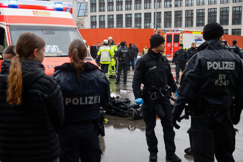 Members of the emergency services work at the scene where a car drove into a crowd in the southern German city of Munich on February 13, 2025 leaving several people injured, police said. Munich police said on social media platform X that "several people were injured" after "a car drove into a group of people" in the centre of the Bavarian state capital. (Photo by Michaela STACHE / AFP)