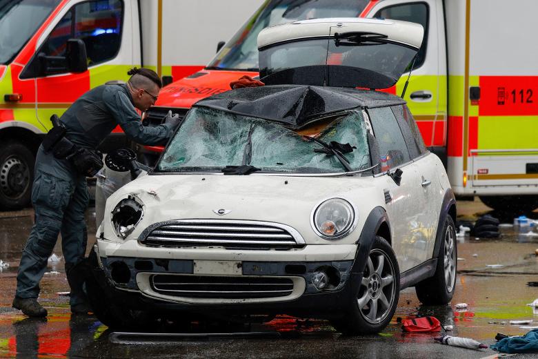 Members of the emergency services work at the scene where a car drove into a crowd in the southern German city of Munich on February 13, 2025 leaving several people injured, police said. Munich police said on social media platform X that "several people were injured" after "a car drove into a group of people" in the centre of the Bavarian state capital. (Photo by Michaela STACHE / AFP)