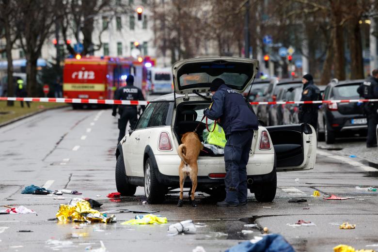 Police work at the scene where a car drove into a crowd in the southern German city of Munich on February 13, 2025 leaving several people injured, police said. Munich police said on social media platform X that "several people were injured" after "a car drove into a group of people" in the centre of the Bavarian state capital. (Photo by Michaela STACHE / AFP)