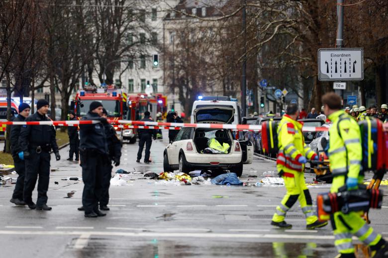Members of the emergency services work at the scene where a car drove into a crowd in the southern German city of Munich on February 13, 2025 leaving several people injured, police said. Munich police said on social media platform X that "several people were injured" after "a car drove into a group of people" in the centre of the Bavarian state capital. (Photo by Michaela STACHE / AFP)