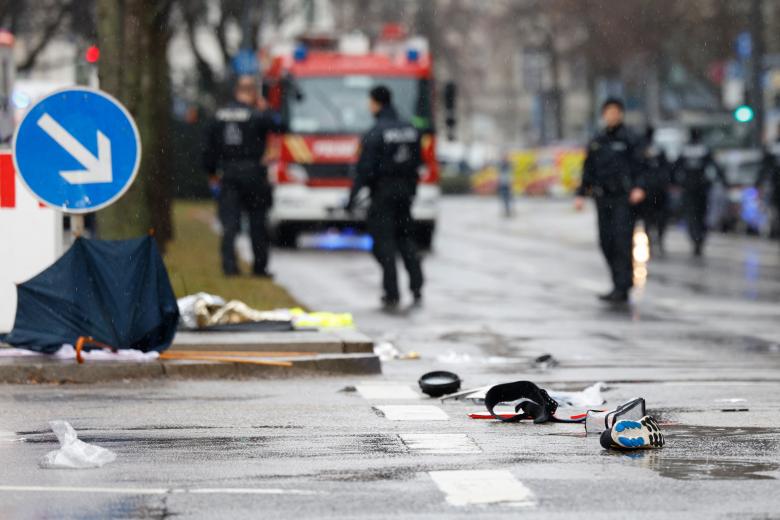 Members of the emergency services work at the scene where a car drove into a crowd in the southern German city of Munich on February 13, 2025 leaving several people injured, police said. Munich police said on social media platform X that "several people were injured" after "a car drove into a group of people" in the centre of the Bavarian state capital. (Photo by Michaela STACHE / AFP)
