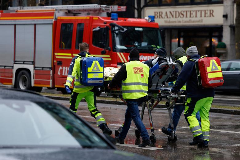 Members of the emergency services work at the scene where a car drove into a crowd in the southern German city of Munich on February 13, 2025 leaving several people injured, police said. Munich police said on social media platform X that "several people were injured" after "a car drove into a group of people" in the centre of the Bavarian state capital. (Photo by Michaela STACHE / AFP)