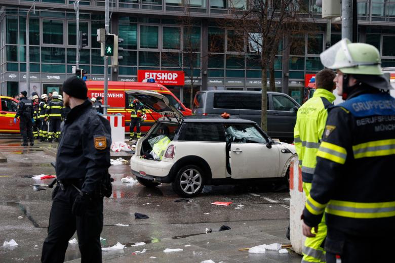 An injured person is transported on a stretcher by members of the emergency services work at the scene where a car drove into a crowd in the southern German city of Munich on February 13, 2025 leaving several people injured, police said. Munich police said on social media platform X that "several people were injured" after "a car drove into a group of people" in the centre of the Bavarian state capital. (Photo by Michaela STACHE / AFP)