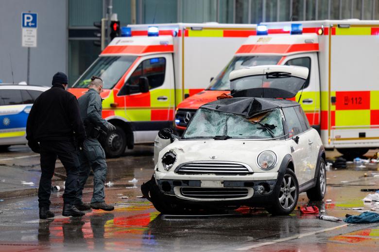 Members of the emergency services work at the scene where a car drove into a crowd in the southern German city of Munich on February 13, 2025 leaving several people injured, police said. Munich police said on social media platform X that "several people were injured" after "a car drove into a group of people" in the centre of the Bavarian state capital. (Photo by Michaela STACHE / AFP)
