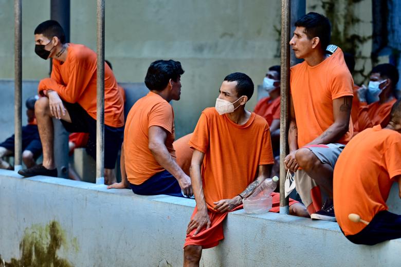 An Ecuadorean soldier escorts inmates during the reinforcement of security in the wards in order to prevent riots, at the Penitenciaria del Litoral in Guayaquil, Ecuador, on April 9, 2025. (Photo by MARCOS PIN / AFP)