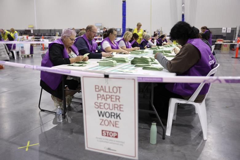 Ballots are seen during counting following the close of polls in Australias general election at a polling station in Melbourne on May 3, 2025. Millions of Australians voted on May 3 in a bitterly contested general election, following a campaign shaped by living costs, climate anxiety and US President Donald Trump's tariffs. (Photo by Martin KEEP / AFP)