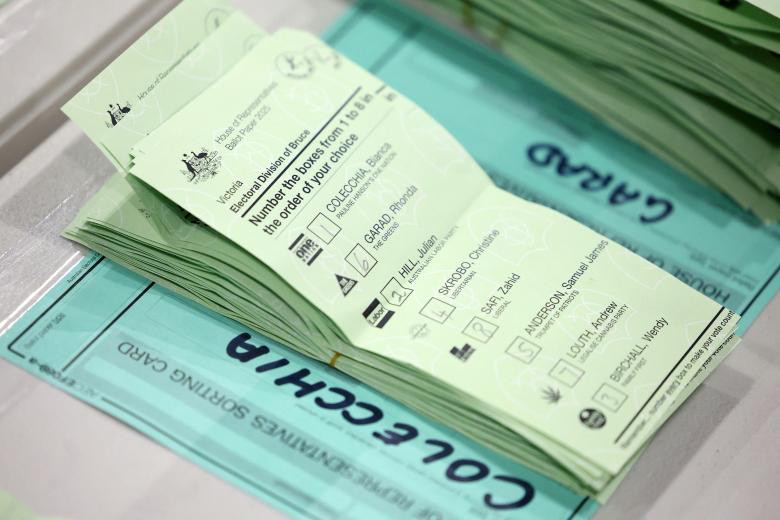 Officials count ballots after voting ended in Australias general election at a polling station in Melbourne on May 3, 2025. Millions of Australians voted on May 3 in a bitterly contested general election, following a campaign shaped by living costs, climate anxiety and US President Donald Trump's tariffs. (Photo by Martin KEEP / AFP)