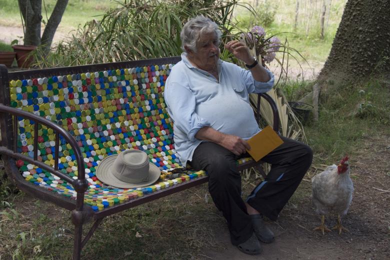 Uruguayan former President an guerrillas Jose Mujica speaks during the shooting of an interview by director Emir Kusturica at Mujica's home in Montevideo on December 12, 2016. Kusturica is shooting the last scenes of his documentary about Mujica. (Photo by Pablo PORCIUNCULA / AFP)