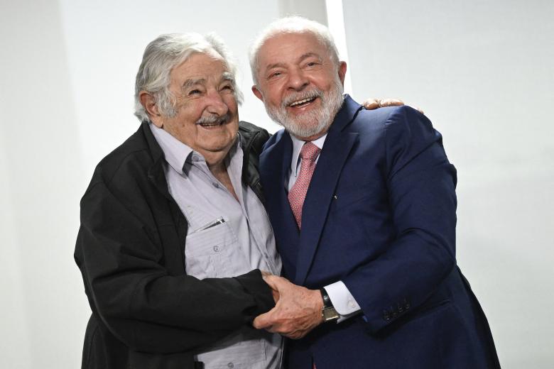 (L-R) Uruguayan former Presidents Luis Alberto Lacalle (1990-1995), Julio Maria Sanguinetti (1985-1990, 1995-2000) and Jose Mujica (2010-2015), and current President Luis Lacalle Pou attend a parliamentary session in commemoration of the 50th anniversary of the beginning of the Uruguayan dictatorship (1973-1985) at the Legislative Palace in Montevideo, on June 26, 2023. (Photo by Pablo PORCIUNCULA / AFP)