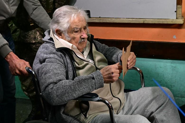 Uruguayan former President Jose Mujica leaves after a press conference at the headquarters of the Movimiento de Participacion Popular (Movement of Popular Participation, MPP) party in Montevideo on April 29, 2024. Uruguay's leftist ex-leader Jose Mujica, once known as the world's "poorest president" for giving away most of his salary and driving an old Volkswagen Beetle, revealed Monday he was battling a tumor. (Photo by AFP)