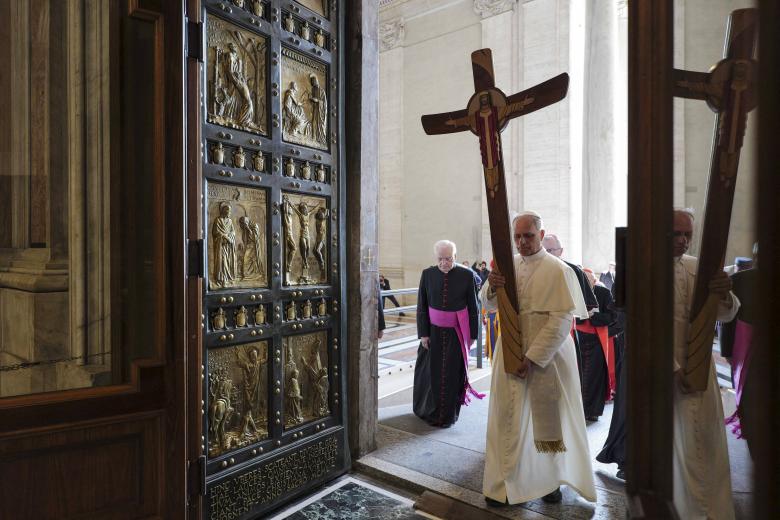This handout photograph taken and released on June 9, 2025, shows Pope Leo XIV walking through the Holy Door to enter in the St Peter's Basilica prior to the Holy Mass as part of the Jubilee 2025 of the Holy See, in The Vatican. (Photo by Simone Risoluti / VATICAN MEDIA / AFP) / RESTRICTED TO EDITORIAL USE - MANDATORY CREDIT "AFP PHOTO / VATICAN MEDIA" - NO MARKETING NO ADVERTISING CAMPAIGNS - DISTRIBUTED AS A SERVICE TO CLIENTS