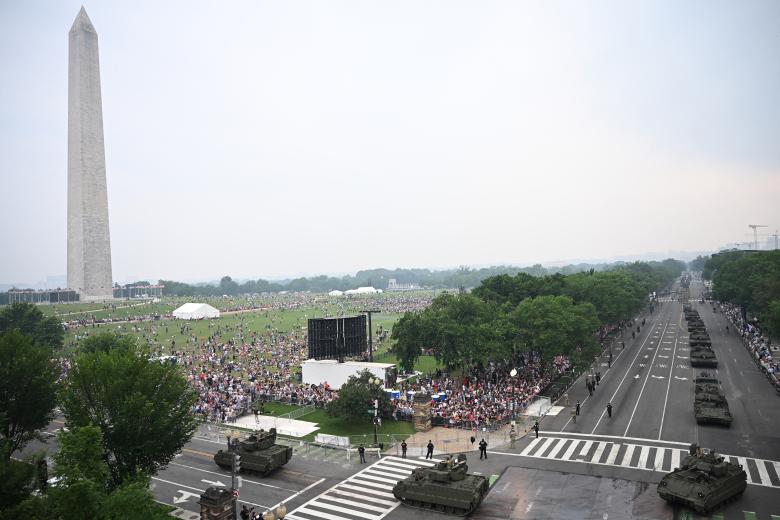 US Army robot dogs go past during the Army 250th Anniversary Parade in Washington, DC, on June 14, 2025. US President Donald Trump reveled in a long dreamt-of military parade on his 79th birthday Saturday, as demonstrators across the country branded him a dictator in the biggest protests since his return to power. (Photo by Mandel NGAN / AFP)