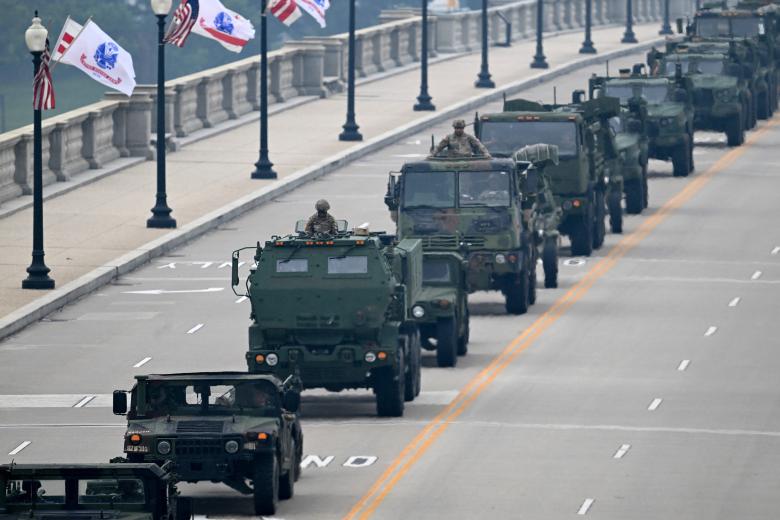Helicopters are seen near the base of the Washington Monument during the Army 250th Anniversary Parade in Washington, DC, on June 14, 2025. Trump's long-held dream of a parade will come true as nearly 7,000 troops plus dozens of tanks and helicopters rumble through the capital in an event officially marking the 250th anniversary of the US army. (Photo by Mandel NGAN / AFP)