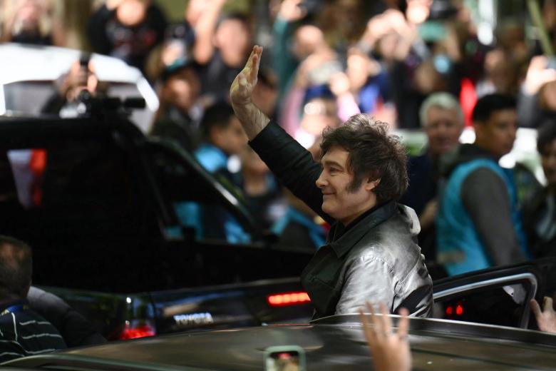 Karina Milei, the sister and right-hand woman of Argentina's President Javier Milei, arrives with him at the polling stating where he votes during the national midterm legislative election, in Buenos Aires on October 26, 2025. Argentines head to the polls for a midterm election that will determine whether President Javier Milei enters the second half of his term bolstered or diminished as economic troubles abound despite unprecedented US aid. (Photo by Emiliano LASALVIA / AFP)