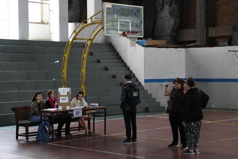 Argentina's Security Minister and Senate candidate for the La Libertad Avanza party, Patricia Bullrich, votes at a polling station during the national midterm legislative election, in Buenos Aires, on October 26, 2025. Argentines head to the polls for a midterm election that will determine whether President Javier Milei enters the second half of his term bolstered or diminished as economic troubles abound despite unprecedented US aid. (Photo by JUAN MABROMATA / AFP)