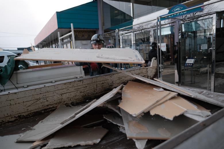 Workers remove debris at the commercial facility "Hachinohe Shopping Center Lapia" after a magnitude-7.5 earthquake struck off the northeastern coast of Aomori Prefecture at 11:15 p.m. on December 8. A seismic intensity of upper 6 on the Japanese intensity scale of 0 to 7 was observed in Hachinohe City. The Japan Meteorological Agency lifted its tsunami advisory at 6:20 a.m., prompted by the quake. Still, the Meteorological Agency issues the "Off the Coast of Hokkaido and Sanriku Subsequent Earthquake Advisory" to urge an alert for a potentially larger earthquake. ( The Yomiuri Shimbun ) (Photo by Hiroto SEKIGUCHI / The Yomiuri Shimbun via AFP)