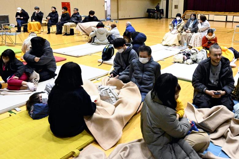 People are staying in the elementary school gymnasium that has been turned into a shelter at Kamaishi Elementary School in Kamaishi City, Miyagi Prefecture, on December 9, 2025, due to the effects of the Magnitude 7.6 earthquake that struck off the east coast of Aomori Prefecture. Around 11:15 pm on December 8, an earthquake struck off the east coast of Aomori Prefecture, reaching a seismic intensity of 6+ on the Japanese scale in Hachinohe City. The epicenter was estimated to be 50 kilometers deep, with a magnitude of 7.6. The Japan Meteorological Agency issued a tsunami warning for the Pacific coasts of Hokkaido and the Tohoku region. ( The Yomiuri Shimbun ) (Photo by Ikuya Oshio / The Yomiuri Shimbun via AFP)