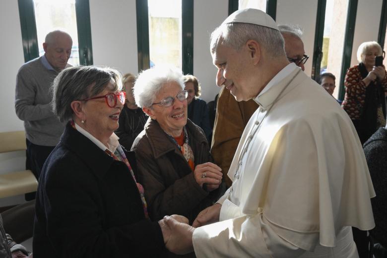ROME (Italy), 08/03/2026.- A handout picture provided by the Vatican Media shows Pope Leo XIV (2-R) greets the faithful upon his arrival during his pastoral visit at the parish of 'St. Mary of the Presentation', in the Roman suburbs of Torrevecchia in Rome, Italy, 08 March 2026. (Papa, Italia, Roma) EFE/EPA/VATICAN MEDIA HANDOUT HANDOUT EDITORIAL USE ONLY/NO SALES