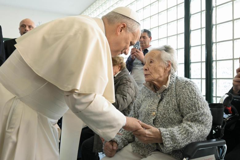 ROME (Italy), 08/03/2026.- A handout picture provided by the Vatican Media shows Pope Leo XIV (R) greets the faithful upon his arrival during his pastoral visit at the parish of 'St. Mary of the Presentation', in the Roman suburbs of Torrevecchia in Rome, Italy, 08 March 2026. (Papa, Italia, Roma) EFE/EPA/VATICAN MEDIA HANDOUT HANDOUT EDITORIAL USE ONLY/NO SALES