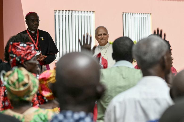 Pope Leo XIV (C) visits the Nursing Home of the Little Sisters of the Poor in Saurimo on the eighth day of an 11-day apostolic journey to Africa, on April 20, 2026. (Photo by Alberto PIZZOLI / AFP)